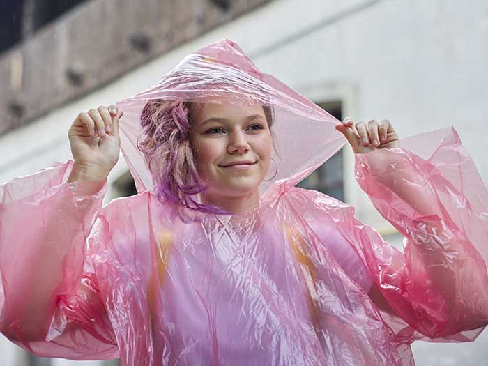 Portrait-of-a-beautiful-teen-girl-walking-in-the-rain-dressed-in-a-raincoat---valeriygoncharukphoto